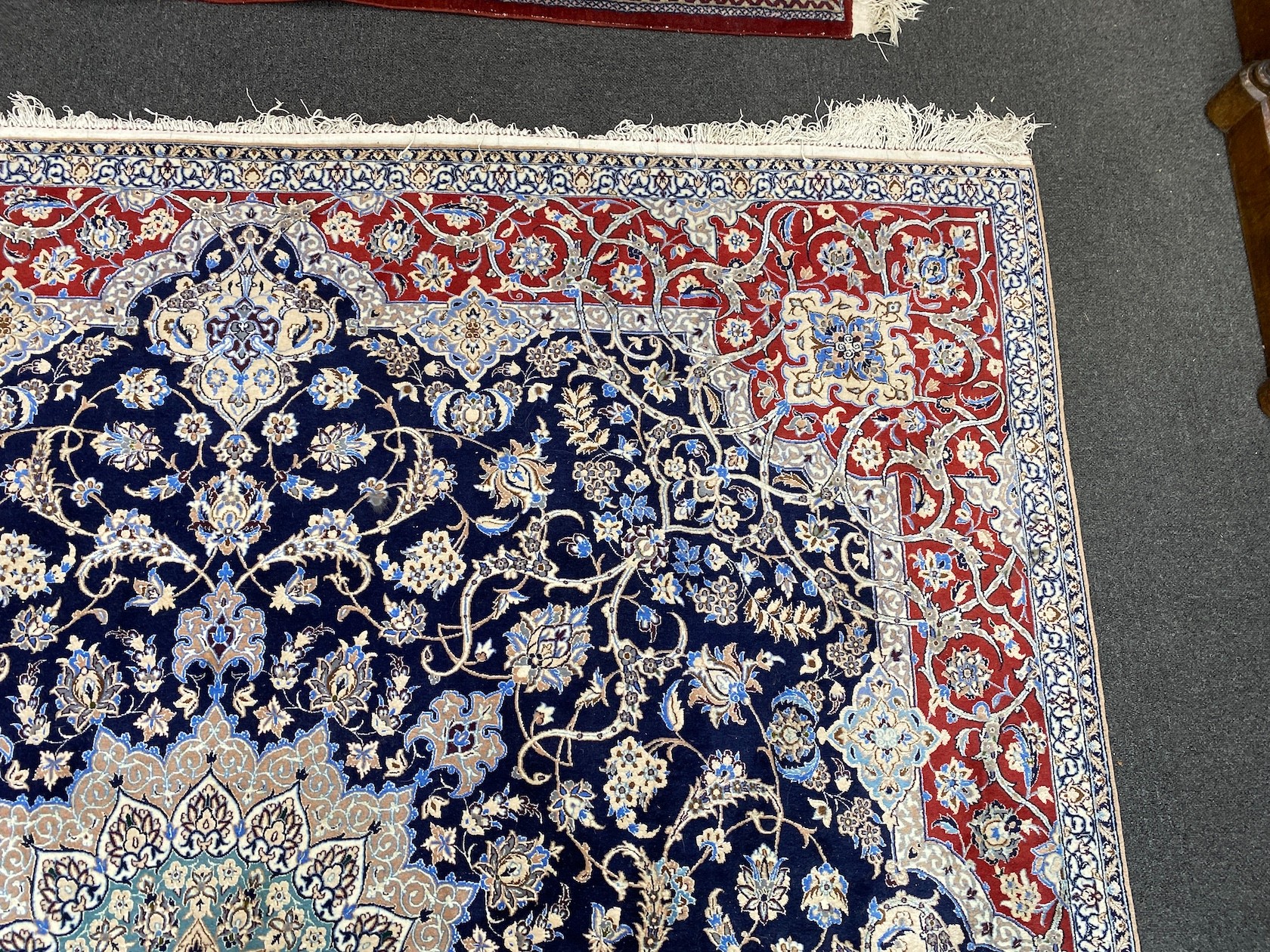 A North West Persian blue ground part silk rug, 220 x 217cm together with a similar smaller red ground rug